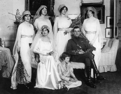 Bride and Bridegroom with Bridesmaids and Train Bearers by English Photographer